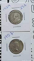Both 1929 and 1957 25-cent coins in flips, overview of lot