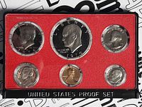Obverse view of all six coins in sealed 1974 proof set case
