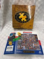 Front of Dowdle Puzzles box and back panel showing Costco puzzle image and details