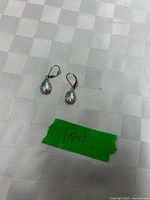 Front view of earrings showing iridescent stones and leverback hooks