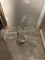 Group shot of all six white wire organizers on floor