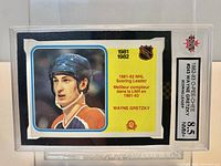 Front view of slabbed 1982-83 O-Pee-Chee Wayne Gretzky #243 card showing KSA 8.5 grade label and card details