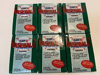 Six sealed green 1992 Fleer Baseball trading card packs front view