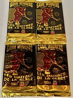 Group of four sealed 1995-96 Pinnacle McDonald’s Game Winners 3-D foil packs