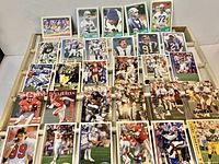 Sample selection of NFL trading cards laid out in rows, various designs visible
