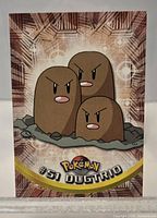 Front view of Topps Pokémon Dugtrio #51 card