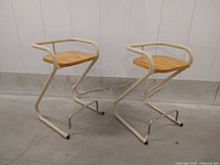 Pair of stools front view showing design and condition