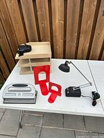 Group shot showing desk lamp, paper sorter, bookends, hole punch