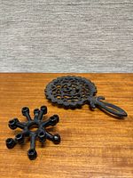Top view of both cast iron pieces on wood surface