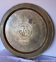 Front view showing entire brass tray with Fu character and engravings