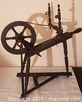 Left side view showing full spinning wheel profile