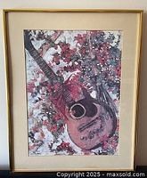 Front view of framed guitar art