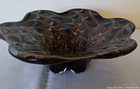 top view showing ruffled rim and swirl pattern