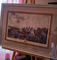 Full view of framed engraving on easel