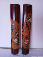 Front view of both bamboo panels showing painted designs
