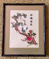 Front view of framed embroidered panel showing complete artwork, mat and frame