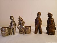 Front view showing all four figures side by side