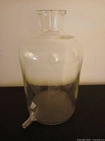 Full view of glass aspirator bottle showing overall form and condition