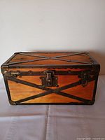 front view of pine trunk with iron cross straps and latch