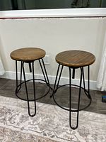 Two matching adjustable swivel stools