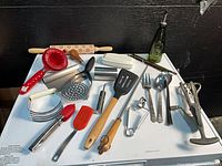 All utensils and gadgets on white surface