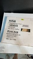 Bennett box showing birch veneer edge banding roll, size 250 ft / 76 m, partial view of tape