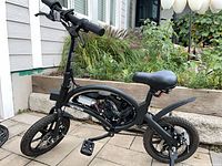 Full left-side view of black Jetson folding e-bike, showing frame, wheels, seat, handlebars