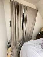 Curtains hanging on window, full length shown