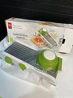 Mandoline slicer, hand guard and original box
