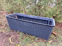 Oblique view of entire planter showing wicker texture