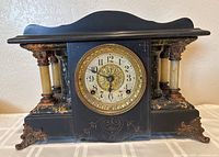 Front view of Seth Thomas mantel clock showing case, dial, columns and feet