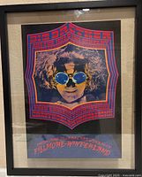 Overall view of framed concert poster in float frame