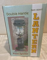 Front of retail box showing image of lantern and item details