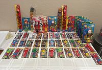 Overall lot of 48 sealed Flix & Klix dispensers displayed on table