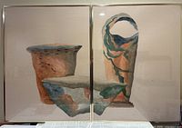 Full view of both framed panels showing artwork and frames