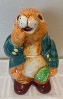 Front view of ceramic Peter Rabbit cookie jar showing full design and colors