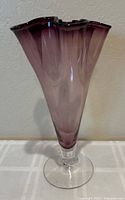Full frontal view of the purple ruffled handkerchief vase