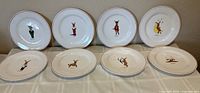 All eight reindeer plates displayed upright and flat