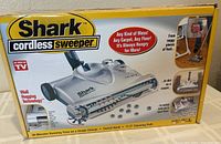 Front of boxed Shark UV610 cordless sweeper