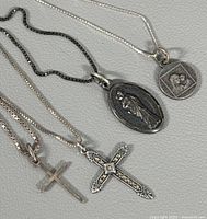 Front view showing all three sterling necklaces and their pendants