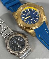 Invicta Pro Diver watch and Roots watch side by side