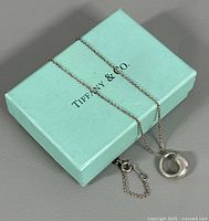 Necklace draped over Tiffany box