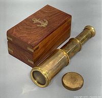 Telescope extended with cap and wood box closed