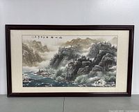 Front view of framed landscape artwork