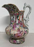Full view left side of signed hand-painted famille rose porcelain water pitcher