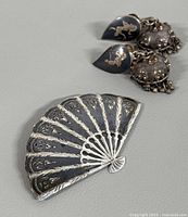 Fan brooch front and earrings grouped