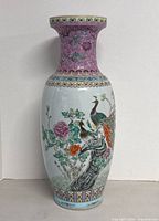 Full view of vase front showing peacock design