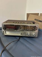 Front view showing Yorx branding, 8-track slot, controls, and radio dial