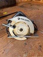 Front view of Black & Decker circular saw showing blade and guard