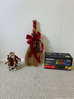 All three items together: Santa figurine, broom hanger, boxed NOMA lights